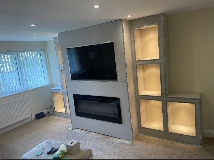 The same media wall once it had been decorated, with a television and fire fitted